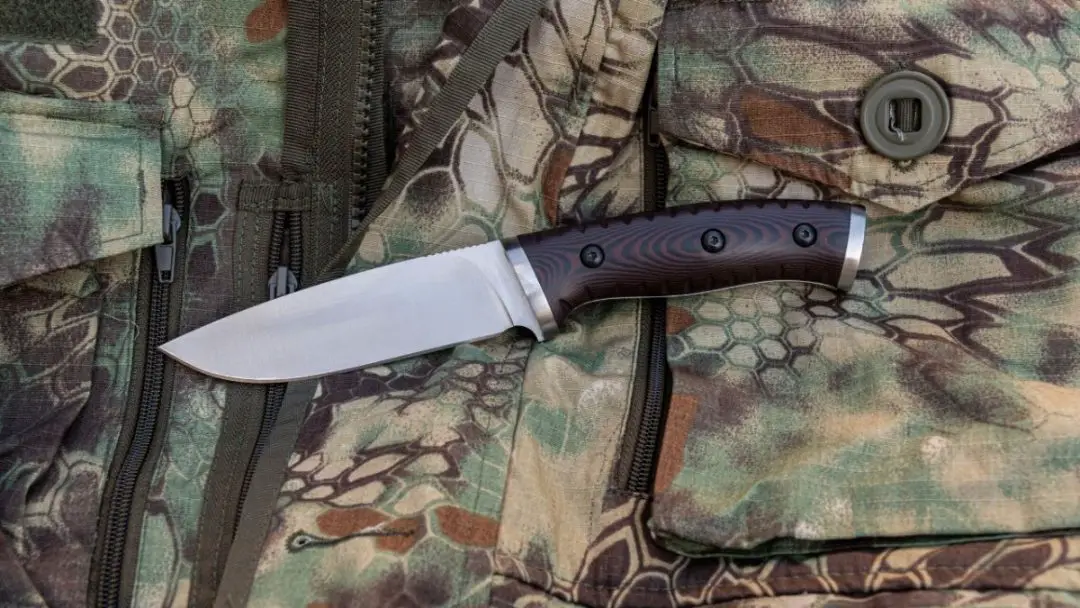 photo of a skinning knife on camo