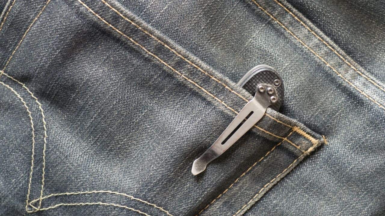 photo of a pocket knife clipped in a jean pants pocket