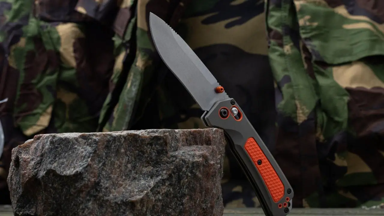 phot of orange and gray benchmade folding knife